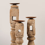 Bleached candle holders on iron base