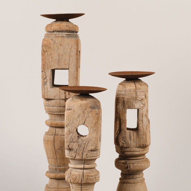 Bleached candle holders on iron base