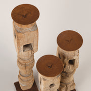 Bleached candle holders on iron base