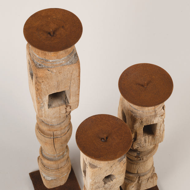 Bleached candle holders on iron base