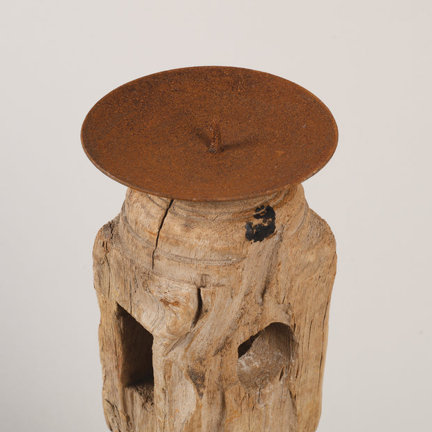 Bleached candle holders on iron base