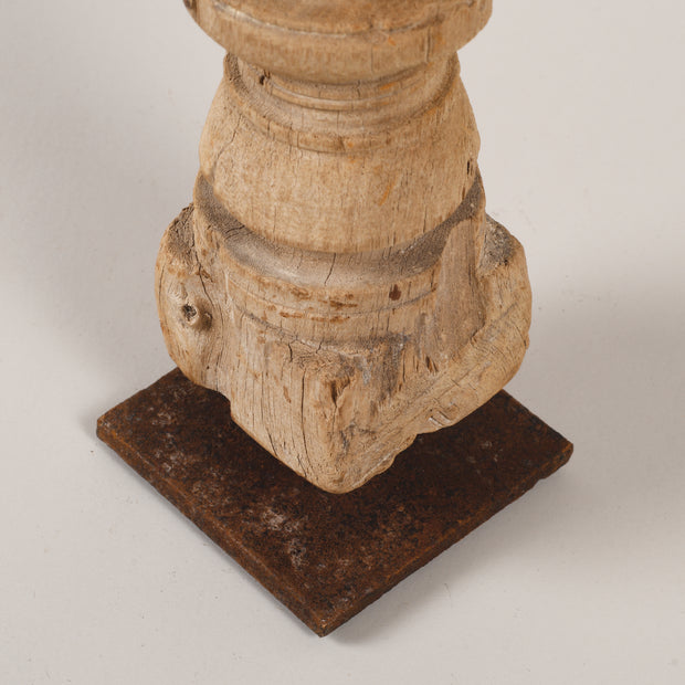 Bleached candle holders on iron base