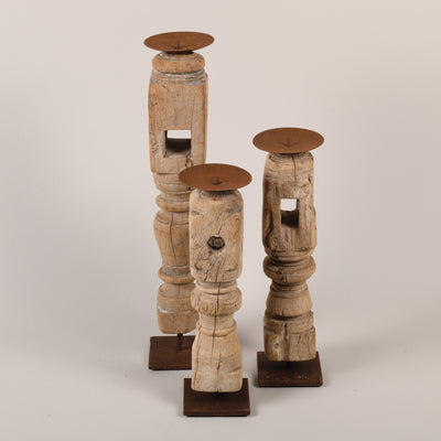 Bleached candle holders on iron base