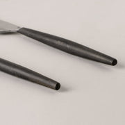 Smooth burnished handle knife